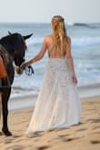 I bought this dress for some engagement photos on the beach. The top part was really loose on the sizes, but after a friend sewed it so it was taut, it looked great! The nude bodysuit underneath is visible through the lace, so I'm not sure I'd wear it for any other occasion but was great for pictures. - Lauren K.