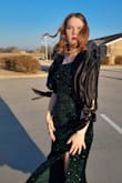 The dress was true to size and a gorgeous color! It was also much softer than I expected, especially considering the sequins. I decided to add some silk sleeves to it, and that was such an easy change to make! Lovely length, and I'm pretty tall (5'9"). - Ella Z.