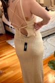 Maybe I should have tried a smaller size, but the back could not be tied without the bottom of the back folding awkwardly. Material was also not flattering - Auriel G.