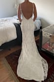 Fits true to size, I generally wear a small but based on measurements got a medium. Fit perfectly in my lower body, will need to get the straps shortened which should fix the top. Prettier in person than online. Looks very high quality. Is a heavy dress but seems comfortable and does have some give. - Alya H.