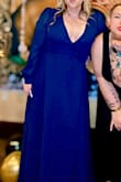 I loved this dress!!! I bought a deep plunge silicone bra to wear with this dress and it was perfect. I also added a couple pieces of double-sided tape in the bust because I'm larger busted. I've never felt as beautiful in a dress as I did this dress!! I can't recommend it enough!!!!! I may even buy it in another color for a different event. - Suzanne T.