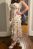 This dress is super flattering! It compliments my chest and waist while covering my stomach area. The cleavage part of the dress has a structure in it to support the girlies which we love. Still planning to wear a bra with it and will use fashion tape to hire my bra straps under the dress ties. - Jordan C.