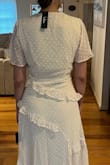 So pretty, but the top needs a pin, the material is thin and kind of see-through and the slit isn't appropriate for most events I have in mind so I'd have to sew it closed a bit. Haven't decided if I will keep it for those reasons. Prob a return just because it's a little more risqué than I want for church or an average dinner outing. However, the dress is truly beautiful especially if you are thin. The ruffles may add weight if you are curvy. Perfect for an airy photoshoot or engagement. - Marline K.