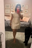 I couldn't resist sharing my thoughts on this dress, despite the less-than-perfect photos! The fabric is incredibly high quality, and thick, and offers a smoothing effect. It accentuates curves beautifully and provides enough support that you can go without a bra. With its generous stretch, you can confidently choose your true size or size down for a more fitted look. Even without shapewear, it's remarkably flattering, which speaks volumes about its design. Perfect for brides, white parties, holiday events, and more! The feather details add a charming touch. - Alina A.