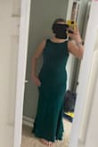 I bought this dress for attending a winter wedding. The material is high quality and thick with a liner. The green is so dark that the color is hard to appreciate in some lighting. There's no zipper and I had to put it on overhead which meant wearing it while doing hair and makeup. All the drama is from behind so it can feel plain by front view but I did get multiple enthusiastic compliments at the wedding! I'd love to see it made in another color too. - Carrie V.