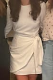 Ordered this for a cooler weather wedding shower and it was perfect! The small was slightly snug on my bum (size 6), but fit perfectly up top. Very classy, and got so many compliments! - Rita P.