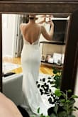 This dress is very well made. Looks and feels expensive. Very form-fitting, but thick quality fabric doesn't show any lumps or bumps. The length is nice with heels and I could easily walk in this dress. I didn't have anyone home to help zip up the back, but I loved the open back and the details on the straps. Very elegant. - Kacie R.