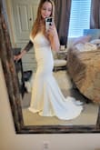 This dress is of amazing quality with enough durable fabric but light enough for a beach wedding. It has beautiful lace vines and hugs the curves perfectly with a cute train behind! I love the bra pads, so no need for inserts or help with a lift! - Steph B.