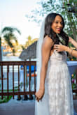 Such a lifesaver- amazing quality and excellent pricing. The color is not exactly white so great for bridal events such as engagement photos or non-traditional bride-related activities. I looked much taller wearing this dress. Criss cross back. Total dream of a gown. - Erika C.