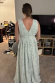 Planning to wear this as a bridesmaid's dress for a wedding in the fall. Really love the color and style. I have broader shoulders and a wider waist, but feel like this dress accentuates the right areas & fits me very well. The straps have a rubber lining to help keep them in place which is also nice. I don't think I would go for this dress if I had a bigger bust since it has such a deep V, but I feel very secure in it. - Hannah C.