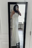 This dress was great. I ordered so many for my wedding & ultimately went with another dress. It's more ivory than white, and I will say that there is a lip of fabric at the waist line that just kinda sits there. It gives a look as if the top of the dress was tucked into the bottom and there is a fabric fold. Otherwise, the dress was great & fit like a glove. I could've gotten away with just [that] - Alyssa R.