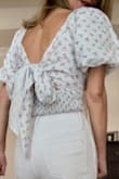 It is so cute. Very confortable. The bow in the back is not uncomfortable when you sit. - Lucia