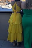 Dress was great. The vibrant yellow, ruffles, and tie back make for a beautiful design. I am 5' 4 and removed one tier of ruffles to make it the perfect midi length for me. Since I have a smaller chest the top was loose and I ended up safety pinning it. - Sophia K.