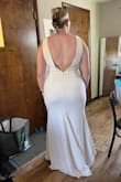 I found my wedding dress! I bought 10 dresses from Lulus to try on, as I have never tried on wedding dresses before and this is the dress I chose! I loved the simplicity of the shapes and the buttons down the back with the low back. The material is thick and has a little stretch so it is very comfortable to move it. I am much larger on the bottom than I am up top so the fit was very flattering on the bottom and needs some simple adjustment with the straps to get the proper fit. I did wear shapewear in the try on process and that was needed for me as I'm very curvy. With the low back, you can see the shapewear I was wearing and I have since found a shapewear that allows for the low back so that will not need any alteration. I feel very confident and happy in this dress and I am so excited that I found it for such an affordable price! - Makenzie B.