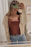 I love this bodysuit! It's very flattering and elegant. I got it to wear for my friend's baby shower. Liked it so much that I'll be buying it in another color :) Measurements are 39-30-41, and I'd say I have a curvier, but fit, figure with thicker thighs. I'm usually a M or L and run an 8 in jeans. Based on the size chart for bust and waist measurements, I should be a large, but the medium fit perfect. I'd say, if you're in between sizes according to the size chart, then size down. - Christina S.