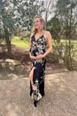 I bought this dress to wear to a wedding. I am 5 months pregnant so I wanted something flowy over my belly. This dress did not disappoint! I got so many compliments on it. I usually wear a medium when I'm not pregnant, but I did need a size large with my baby bump (I'm currently 155 lbs while pregnant). - Charlotte W.