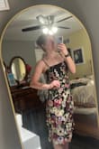 As soon as I saw this dress I knew it was the one to wear to my brother's wedding. I've never had an opportunity to wear a fancier dress so I was beyond excited to find this one. It is very unique and stunning. The flowers are embroidered and stitched on which gives the dress a fun flare. The dress is full of personality and uniqueness in the best way possible. The quality is great! The fit is near perfect for my height and the lace up back allows you to fit it to yourself. The dress is well made with good fabric and quality flower appliqués. I definitely recommend this dress! - Meredith S.