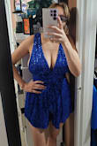 The romper is beautiful, but the chest area it's super open everywhere where wearing a Brad doesn't look good. I have to find me a blue Brad maybe that will work thatch the color not sure it's also super short! My boobs are literally out from the side of the dress. Other than that, the dress is gorgeous. - Susana C.