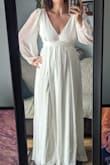 This dress is very beautiful. A bit tight around the ribcage/bust, however based on other reviews I somewhat expected that. The material seems really lovely and feels great. I adore the sleeves and the leg slit. The length is great for me but I am 5'10-11. I'm definitely leaning towards this dress for my elopement! - Shay F.
