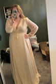 This dress is EVERYTHING I could have dreamed of. I didn't initially order it, but decided to add it on and give it a try. Holy Moly I am glad I did because it is gorgeous. The color is cream, which I loved for my elopement. The wrap dress is extremely flattering on my Apple-shaped body, and the slit is EVERYTHING. The beads on the sleeves are so beautiful, and if you look through all the photos of everyone in this dress, you will see how it literally looks good on everyone. I will need to get the sleeve cuffs taken in and do something about the chest area - either wear boob tape and do no bra, or have my tailor work some magic so my bra won't show. I recommend sizing up to accommodate for a larger chest - it gives you a more flowy look too! I ordered a 3x, normally wear a 1x, and was going to order the 2x but it was out of stock - I am so glad I got the size up! 10/10, I am so excited to wear this dress for my elopement photoshoot in the Grand Canyon and rocks of Arizona. - Katherine S.