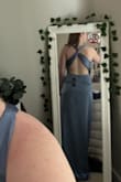 This dress fit me really well, but it was SO long omg. I'm on the shorter side but would've had to get it altered for sure. I also think that I would've been messing with the straps since it twists in the back and doesn't have a way to stay in place. - Brooke P.