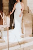 I purchased this dress for my elopement, it hit every expectation I had for my wedding dress. I was looking for something timeless, cost-friendly, fitted, and would match a small chapel's aesthetic. My dress arrived within a few days of ordering it, I am not sure if this is because of where I'm located or if they always ship that fast but it was perfect! I used the size estimator they have available and I am so glad I did because it helped me pick the perfect size. The only downside is I am 5'0 so of course this was long on me, literally every dress is, so personally this was not an issue. I wore 4.3-inch heels and was fine. My dress fit like a glove, I would highly recommend purchasing this dress! - Sabrina B.