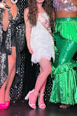 The PERFECT bachelorette party dress! The texture is so unique, it has some sparkle, and the fringe has great movement! It's short but the lining still covers your booty and the fringe offers extra length. I love this dress, looking for other opportunities to wear it! - Beatriz K.