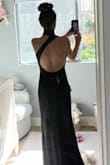 The dress was beautiful but unfortunately I decided to return it, as I did not want to pay to have it hemmed. If you're on the taller side this certainly won't be an issue, but I'm 5'3" and even with a 4 1/2 inch heel it was way too long. - Laura B.