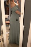 This dress fits true to size and is sooo pretty! My favorite part about this dress is that there are grips on the breast part that will not let the dress fall down. Least favorite part was that it was very long. Even with taller heels, I had to get it hemmed. - Hannah H.