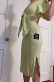 This dress is very cute but I think sizing is a little off. I went with my normal XS and it juuust fit on the bottom but the top was really loose. If I went a size up the bottom would be more comfortable but then you're left with so much fabric up top. You're only solution is to tie the front really tightly and you end up with a huge knot that is not flattering. But I did end up keeping because I like the material and that it has sleeves to protect my shoulders from getting sunburned! - Beatriz K.