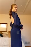I got this dress for my senior prom, and it was so beautiful! The dress fit perfectly; the sleeves were long enough; the neck wasn't too tight, and the length was long enough to wear with my 3 in heels. The open back was so classy, and I received many compliments on the uniqueness of my dress. I can't wait to wear it again! - Bethany G.