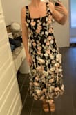 I am always between a small and medium and I went with a medium in this and definitely should've gotten a small. The straps are adjustable but they are silky so they slip out of adjustment easily. I am 5'5" and 130 and small chest, and the medium was big in the chest and waist. I loved the texture the flowers gave the dress but the big ones looked droopy like they were maybe falling off. - Cara A.