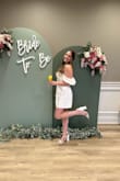 I bought this with a bunch of other white outfits from Lulus and ended up loving this dress the most. It was absolutely perfect for my bridal shower. I felt super comfortable and beautiful in it. Highly recommend! - Victoria H.
