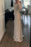 I realllllllly wanted to like this as my wedding dress. I would be curious to know what the size smaller would've fit like, but I also think that it would've been too restricting with the style of dress (low neck line with sleeves attached to the dress). If I kept it, I would look at making it a strapless dress by cutting the sleeves off, but still wearing the sleeves.
It also gave me nightgown vibes. - Mckenna L.