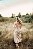 I wore this dress for my pregnancy announcement photos and it was perfect! The colors and print are subtle, and it flows so nicely. The back was a little tricky to tie at first but it's so worth it! - Chelsie C.