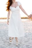 This was the perfect dress for my engagement photoshoot. I felt beautiful! The dress is very flattering, fully lined, and well tailored. It was breezy and smooth as I moved around, and I loved the neckline. I just wish the top 3 buttons across the bust weren't actually usable, I had to sew up the bust the day before. It was perfect once I did that. - Lauren L.