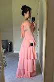Purchased to wear as a bridesmaid for one of my good friend's wedding. The top and torso fit fine; it's just really long. I will have to hem almost the entire bottom ruffle (worn with heels) to fit me properly. I expected this, just an FYI for people who are around my height. - Juliet K.