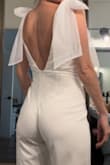 This romper fits like a glove! Even being an XS, it didn't feel snug; there is room for you to move around and even pig around at your party. The tulle should be pressed and makes for a lovely bow. I was very impressed and received many compliments. - Maria L.