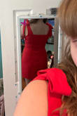 Super cute dress. The material is thinner and stretchier than I assumed it would be, so sizing up may be best if you don't want bra lines to show. - Shelby S.
