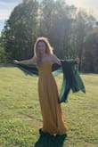 Loved this dress! The color was stunning, the fabric was soft and flowy -definitely high quality! I had to use an adhesive bra for the top because it is backless. And the slit in the dress runs all the way up to the waist. Luckily, I know how to sew a little and I was able to make it to where it wouldn't open where I didn't want it to with a few quick stitches! - Suzannah S.
