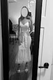 This dress is absolutely gorgeous, but the cute satin belt is held up by a string belt loop on the side, which should be cut off because they look bad. I wish it was a fabric belt loop. Also, the bust area is more suited for a bigger cup size, just FYI - Nathan J.