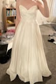 Pretty dress and high quality. Overall, a great value. This same quality dress would cost at least 2-3x the price at a bridal shop. I returned because I didn't think it was very flattering on my body type. I am pretty slender and felt like the dress was swallowing me. This could totally be the perfect dress for a different bride though! - Kaela V.