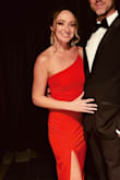 I wore this to a black tie event and got tons of compliments. I am in between a XS and S and went with the S for more breathing room. I am 5'2 and wore 4" heels but still had to get the dress hemmed. I also had them raise the slit about an inch to give it a more sexy vibe. Loved the dress! - Abby D.