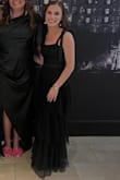 I ordered this dress for a black tie wedding. It was the perfect length and fit and came in fast. I loved the ruffles and the bow-tying straps. The waist part across the middle isn't too see through so it was appropriate but detailed enough that I thought it was a nice touch. I got several compliments, and best of all, I was comfortable all night!!!! - Kiley C.