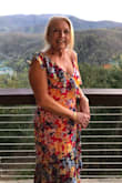 This dress is absolutely beautiful and so colorful. You will certainly stand out in a group! Wore this to my nephew's outside wedding (4/6/24) in the Great Smoky Mountains in TN. A little chilly so needed to wear a jacket outdoors but dinner inside was perfect. The only drawback to the dress was it was a little too tight across my chest and flattened me out - if you know what I mean. I think if l were 10 lbs lighter it would have been perfect. I'm almost 5'6" and the dress was the right length with heels. Don't hesitate buying this dress. You'll look absolutely stunning in it. - Caretta A.