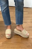 These platform sandals are the cutest! They scream summertime and the color will match any outfit. They are true to size, I'm a 6.5 - I will say the band that goes over your foot is a tad bit tight, and slightly rubs the top of your toes. I think they just need to be broken in and it'll stretch out a little. - Samantha D.