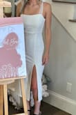 Was the perfect bridal shower dress that wasn't see through. Finding white outfits for all your wedding festivities can be challenging and some white dresses aren't thick enough, but this dress was thick and great quality. Was comfortable and the small slit and dainty straps were the perfect balance of sophistication. - Kelcey S.