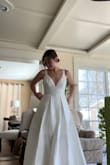In love with this dress. It's very simple, classic, and of a very thick material for the price. The bottom of the fabric started fraying a tiny bit, but I'm getting it hemmed anyway. I love the multiple layers of fabric, and the back is so cute and flattering. This dress looks incredible, and the price can't get any better! (And it has pockets :)) - Jazlyn W.