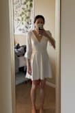This dress is so flattering and pretty. Very good quality, the details are gorgeous. Fit me like a glove, and the bow in the back would make it pretty easy to adjust the waist if you needed to. - Sarah S.
