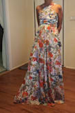 I loved this fabric. The dress was really tight around lower ribs and WAS way too long.  Hemming was expensive so I decided to go with a different dress. - Teresa E.